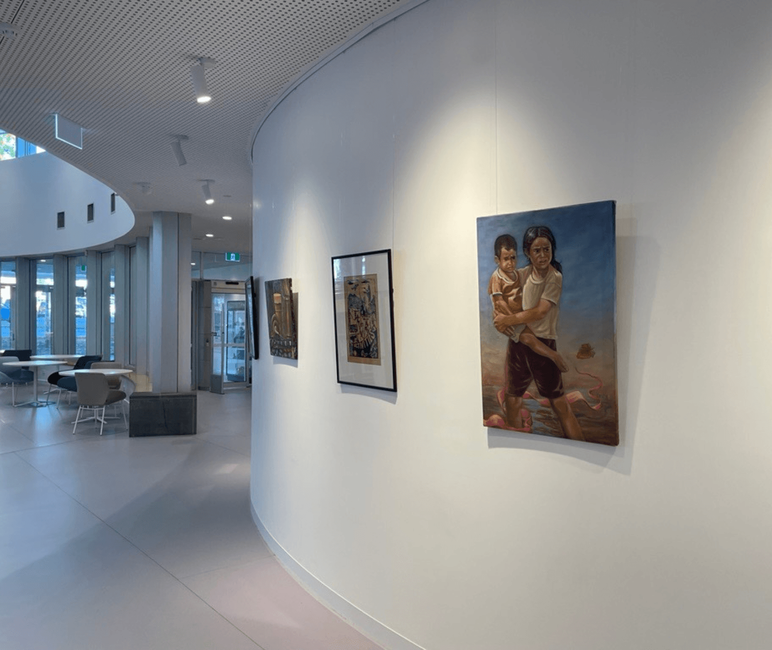 Photo of a paintings featured in the exhibition, on the gallery wall at Ballarat Library.